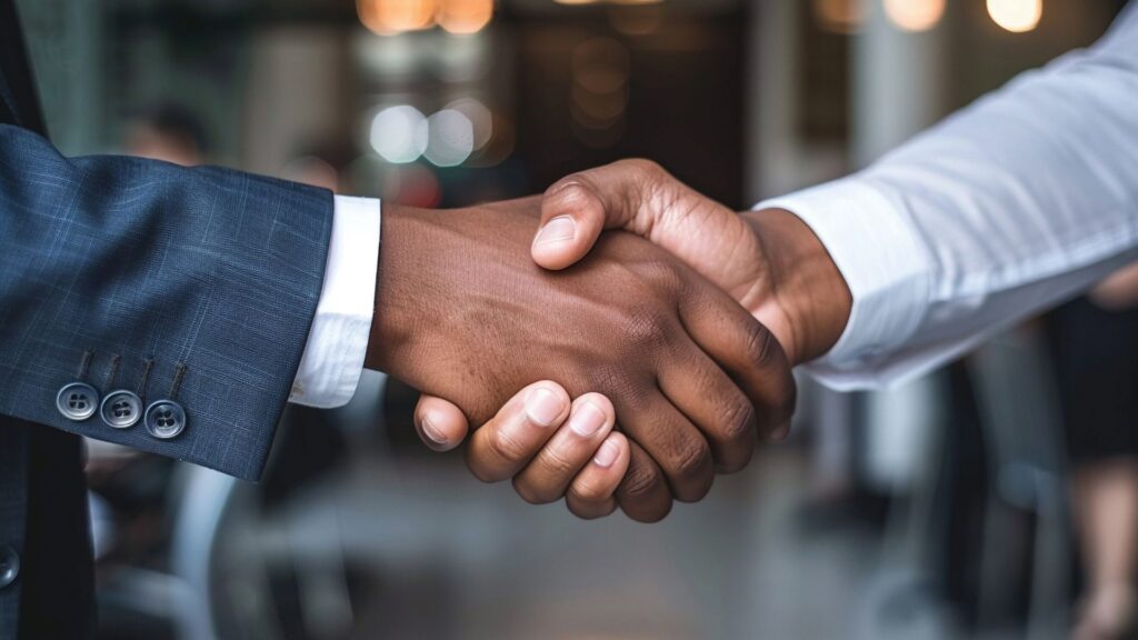 Two contractors shaking hands