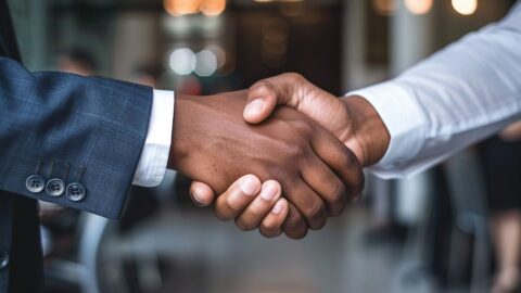 Two contractors shaking hands